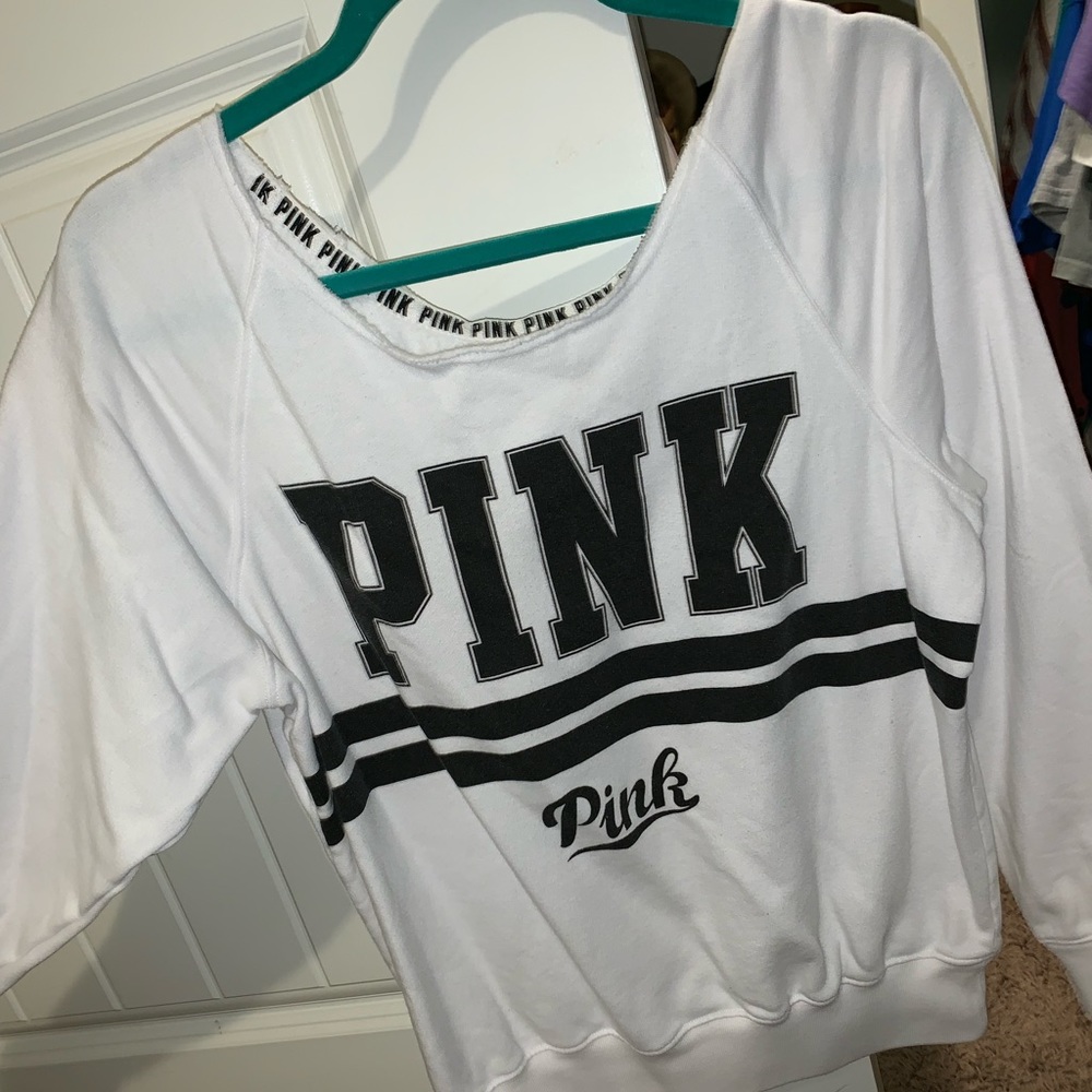 PINK brand scooped neck sweatshirt material.